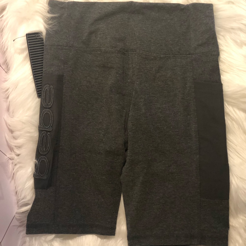 Bebe sport bike shorts with mesh pockets on both sides.   Shorts are size small. - Picture 3 of 3